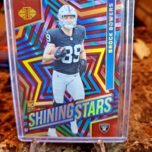 2024 Panini Illusions - Shining Stars Brock Bowers #7 Red /99 (RC)